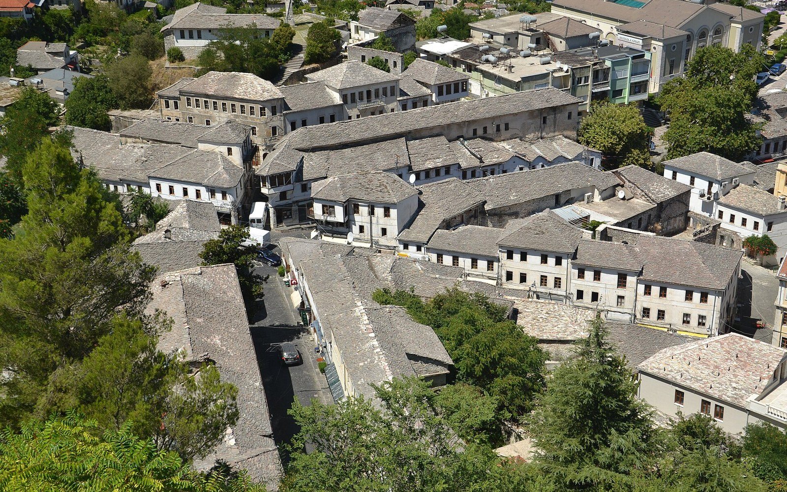Stacked slate roofs of a hillside town in flat morning light